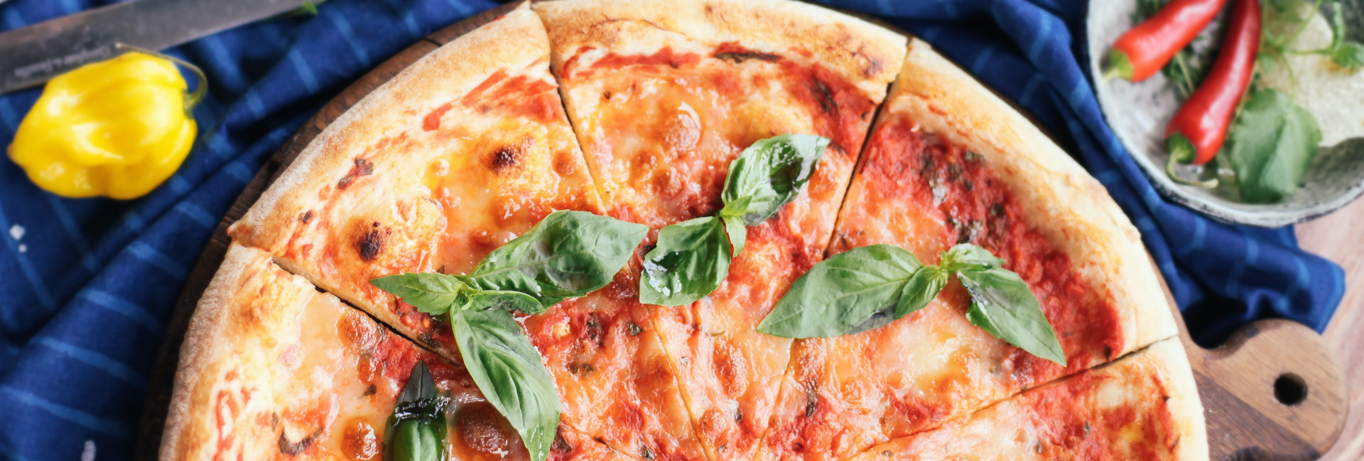 Image of a Margherita pizza on a wooden board
