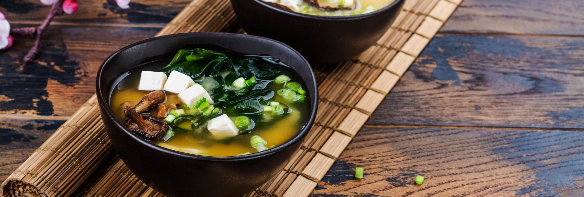 Bowl of Miso Soup set on a wooden table