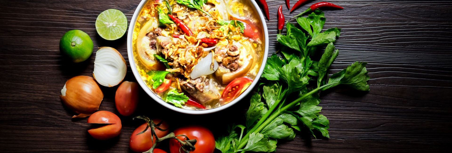 Affal stew surrounded by fresh vegetables