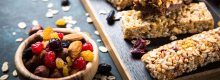 Candied and dried fruit next to granola bars