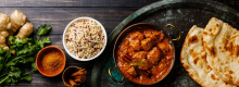 Curry and naan bread on a plate