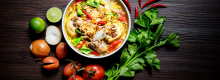 Affal stew surrounded by fresh vegetables