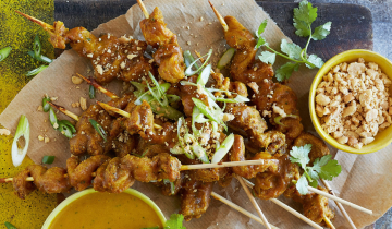 Chicken curry kebabs on platter with dipping sauces