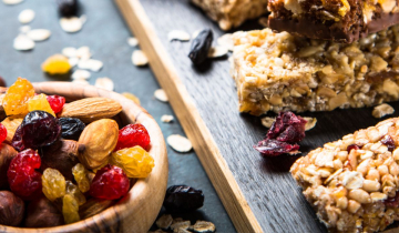 Candied and dried fruit next to granola bars