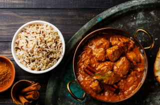 Curry and naan bread on a plate